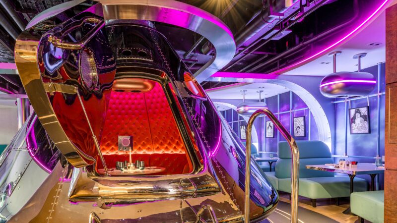 Two full-scale replica Apollo 11 capsules, developed with Timothy Oulton, serve as private dining pods, making the venue a playful, immersive experience unlike anything else at sea.